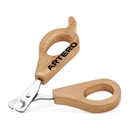 Wooden nail clipper for dogs with 'ARTERO' branding on a white background